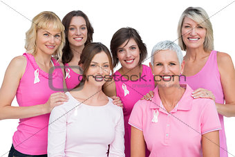 Smiling women posing and wearing pink for breast cancer