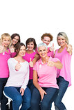 Positive pretty women posing and wearing pink for breast cancer