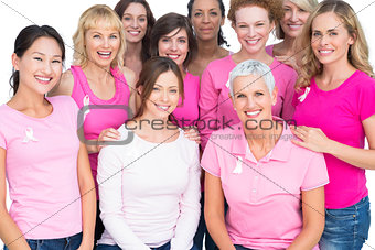 Voluntary pretty women posing and wearing pink for breast cancer