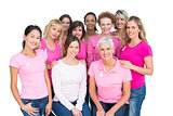 Voluntary cheerful women posing and wearing pink for breast cancer