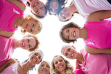 Cheerful women in circle wearing pink for breast cancer