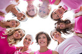 Group of happy women in circle wearing pink for breast cancer