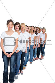 Cheerful casual models posing in a line