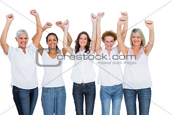 Smiling casual models posing with hands up