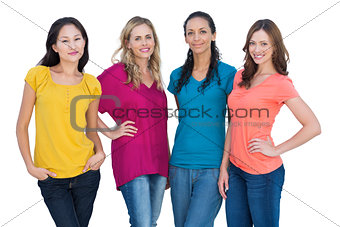 Cheerful models posing with hands on hips