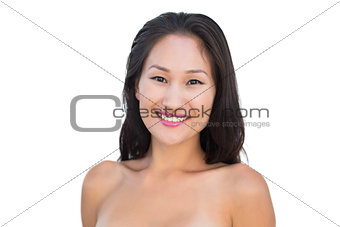 Smiling sensual nude brunette posing