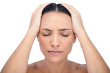 Young woman having strong headache