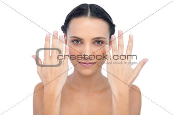 Natural model posing hands up