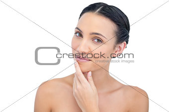 Ralexed sensual model posing with hand on her chin