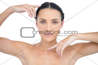 Peaceful attractive topless model gesturing