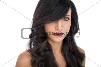 Glamorous brunette with red lips posing