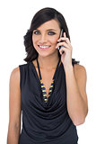 Elegant brown haired model talking on the phone