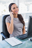Smiling gorgeous businesswoman on the phone