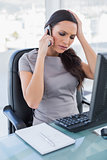 Worried gorgeous businesswoman having a phone call