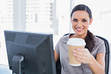 Attractive businesswoman offering coffee