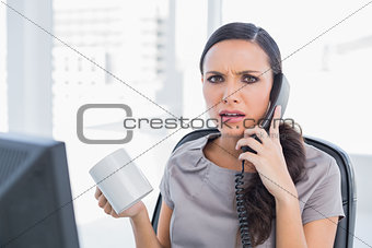 Irritated secretary answering phone