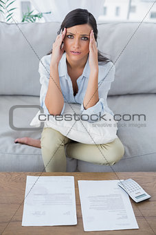 Fed up woman checking her bills