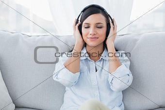 Pretty brunette listening to music