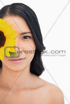 Natural black haired model with sunflower