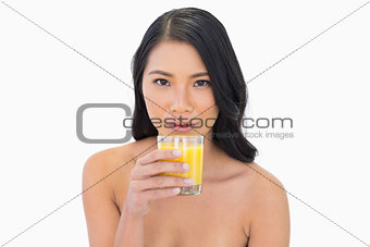 Sensual nude model having orange juice