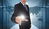 Businessman touching futuristic interface with world map on background