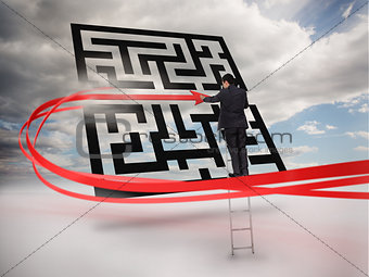 Businessman on ladder tracing red line through qr code