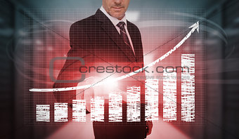 Businessman pressing red chart and arrow interface