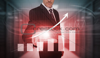 Businessman pressing red growth arrow and bar chart interface