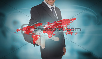 Businessman selecting futuristic red world map interface