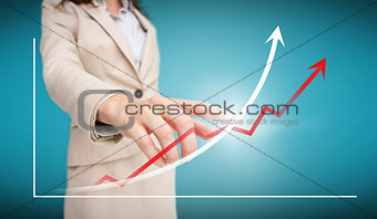 Businesswoman touching futuristic red and white graph with arrows