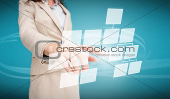 Businesswoman touching futuristic flow chart interface