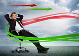 Confident businessman reclining in swivel chair with red and green arrows