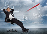 Confident businessman reclining in swivel chair in front of marketing flowchart