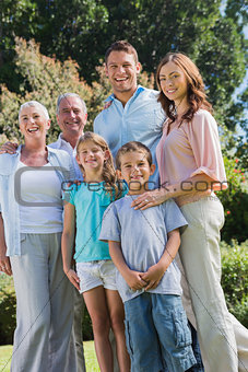 Happy family and grandparents in the park