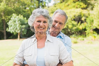 Smiling mature couple in the park