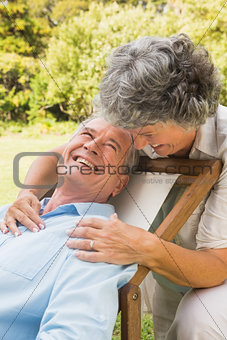 Happy mature woman smiling at her husband
