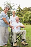 Man in wheelchair and his wife and nurse