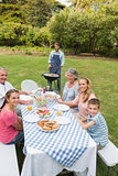 Cheerful extended family having a barbecue