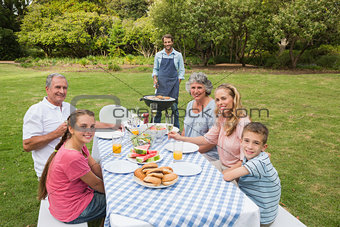 Smiling extended family having a barbecue