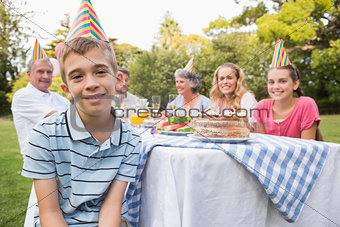 Little boy smiling at camera at his birthday party