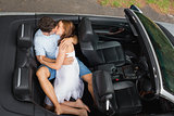 Couple in love kissing in the backseat