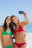 Two sexy friends taking pictures of themselves