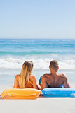 Cute couple in swimsuit taking sun