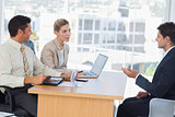 Business people speaking during interview