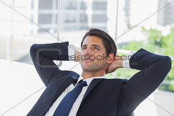 Thoughtful businessman with hands on head