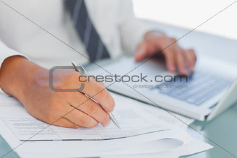 Close up on businessmans hands working