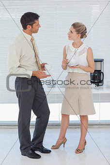 Stylish colleagues having coffee together