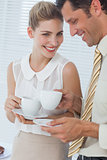 Attractive businesswoman laughing with her colleague