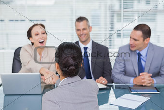 Business team interviewing young applicant
