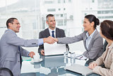 Smiling business people shaking hands